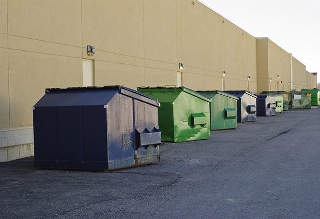 portable, green construction dumpsters serving as a container for scrap materials in Encino